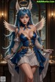 A woman dressed as an angel with blue hair and white wings.